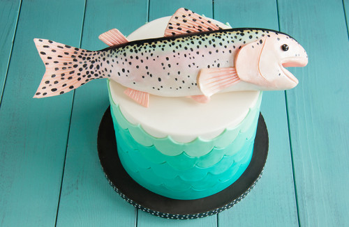 Teal waves birthday cake with trout topper