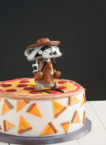 Pizza party cake with Raccoon topper.