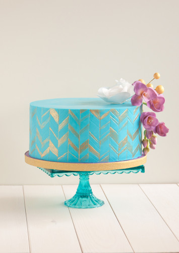 Purple Freesias on a funky cold and teal chevron birthday cake