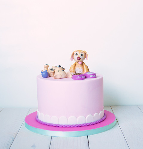 Pink cake with puppy toppers