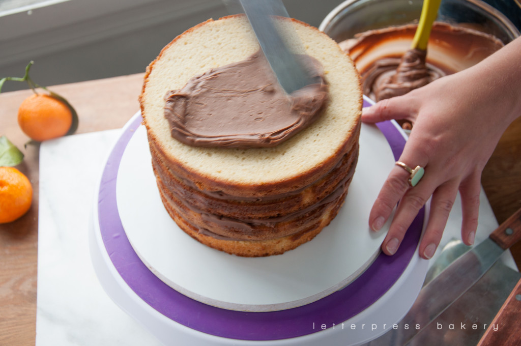 Adding Ganache to the top of the cake